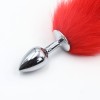 metalen buttplug met lange rode staart